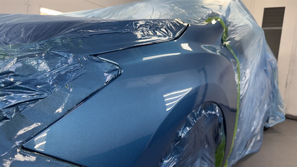 A car masked and ready for paint in the Nova Body Shop paint booth
