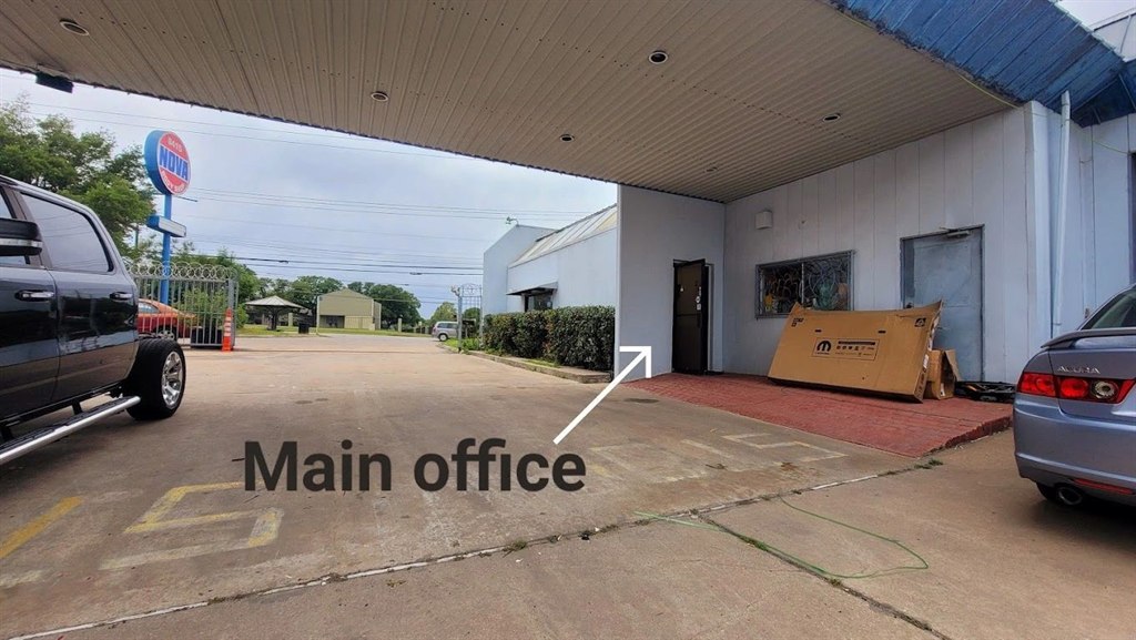 The main office entrance at Nova Body Shop, marked with an arrow