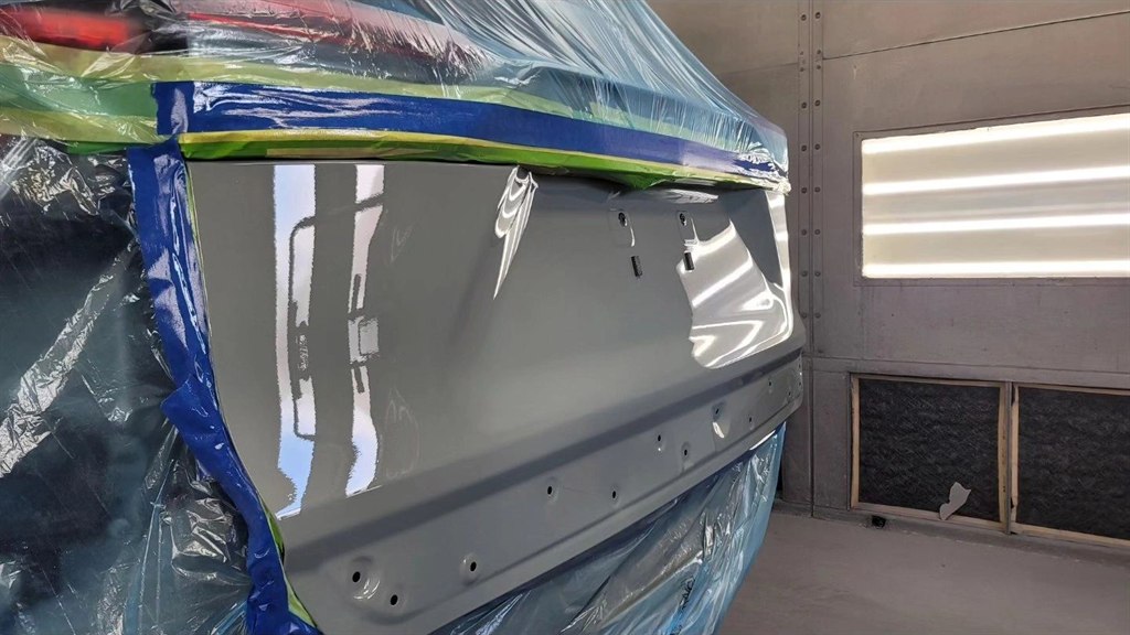 A refinished panel with a mirror-like shine in the Nova Body Shop paint booth
